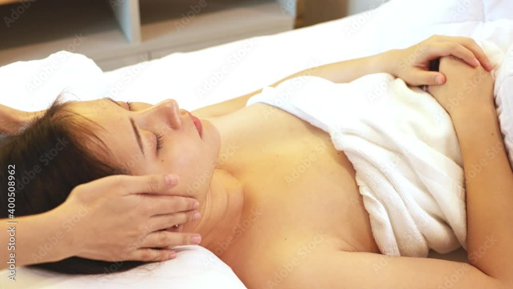 Asian Beautiful, young and healthy woman in spa salon. Massage treatment spa room . Traditional medicine and healing concept. Asian Beautiful, young and healthy woman in spa salon. Massage treatment spa room . Traditional medicine and healing concept.