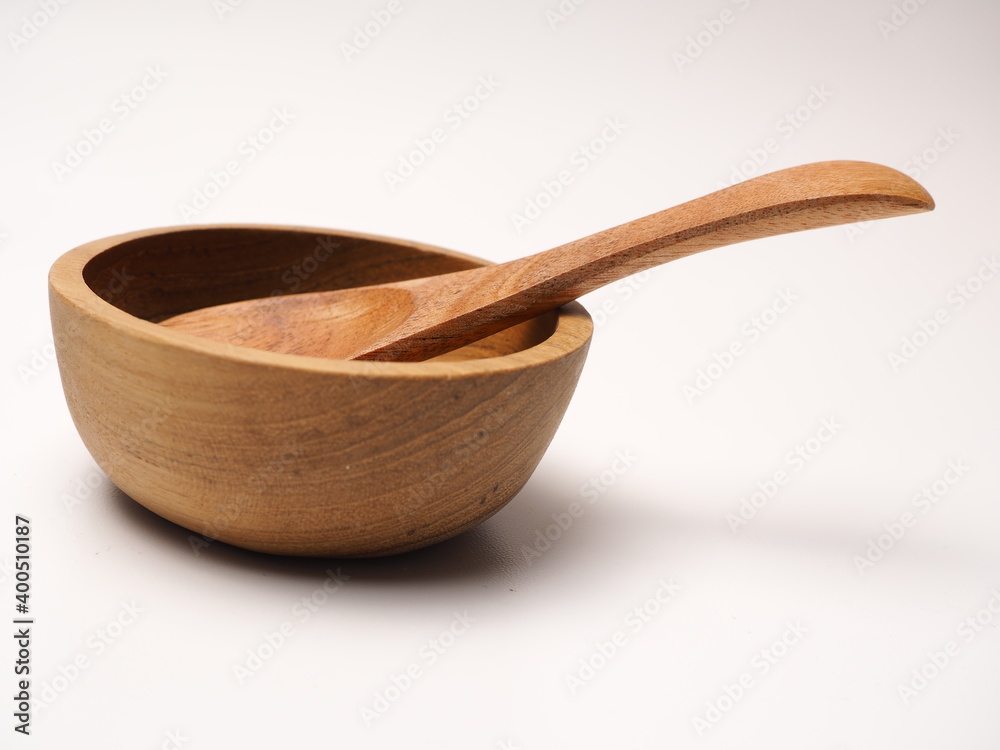 Group of antique wooden dishware that contain spoon, bowl, shoot on a white isolated background Group of antique wooden dishware that contain spoon, bowl, shoot on a white isolated background