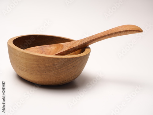 Group of antique wooden dishware that contain spoon, bowl, shoot on a white isolated background