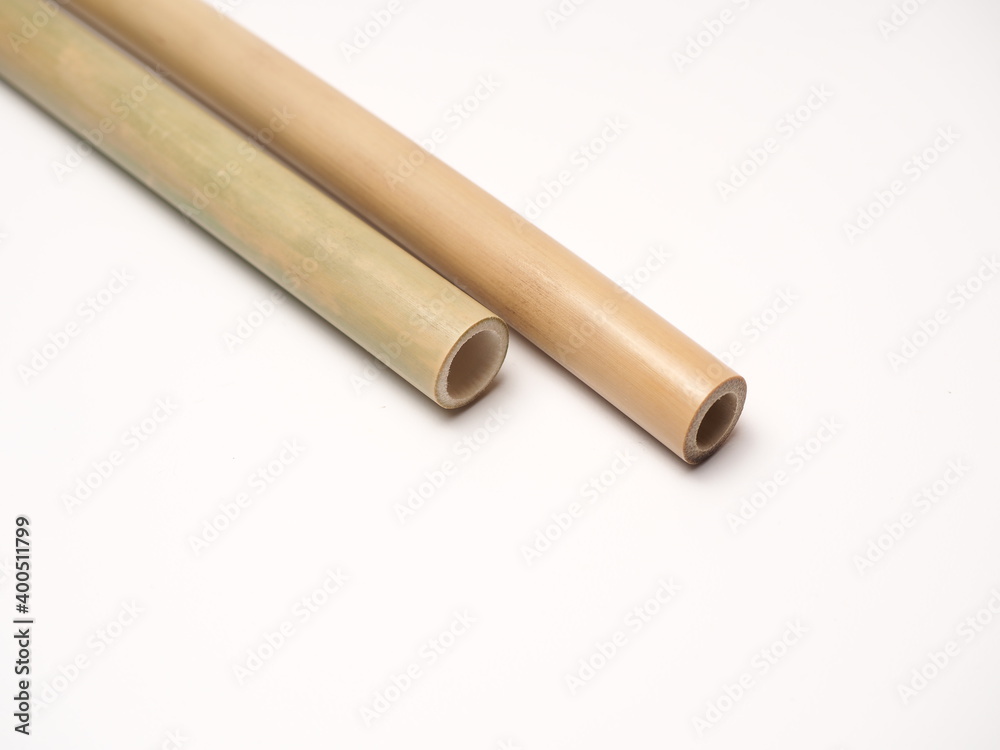 Close up shoot of a pair bamboo straw that more ecofriendly than plastic, shoot on a white isolated background Close up shoot of a pair bamboo straw that more ecofriendly than plastic, shoot on a white isolated background