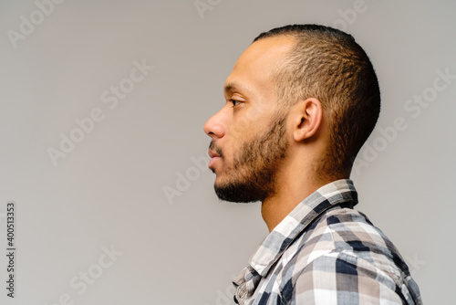 african-american young man wearing casual shirt over light grey background