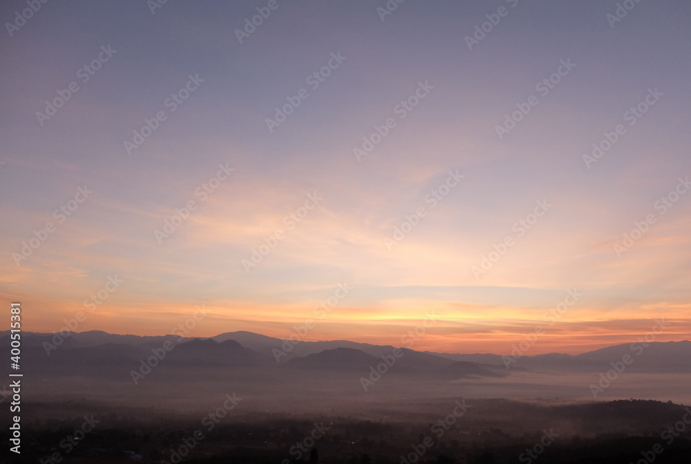 sunrise over the mountains vanilla sky and fog. 