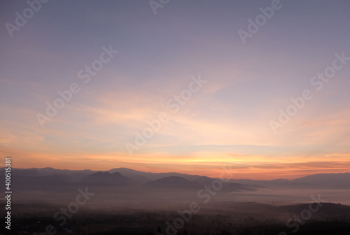 sunrise over the mountains vanilla sky and fog. 