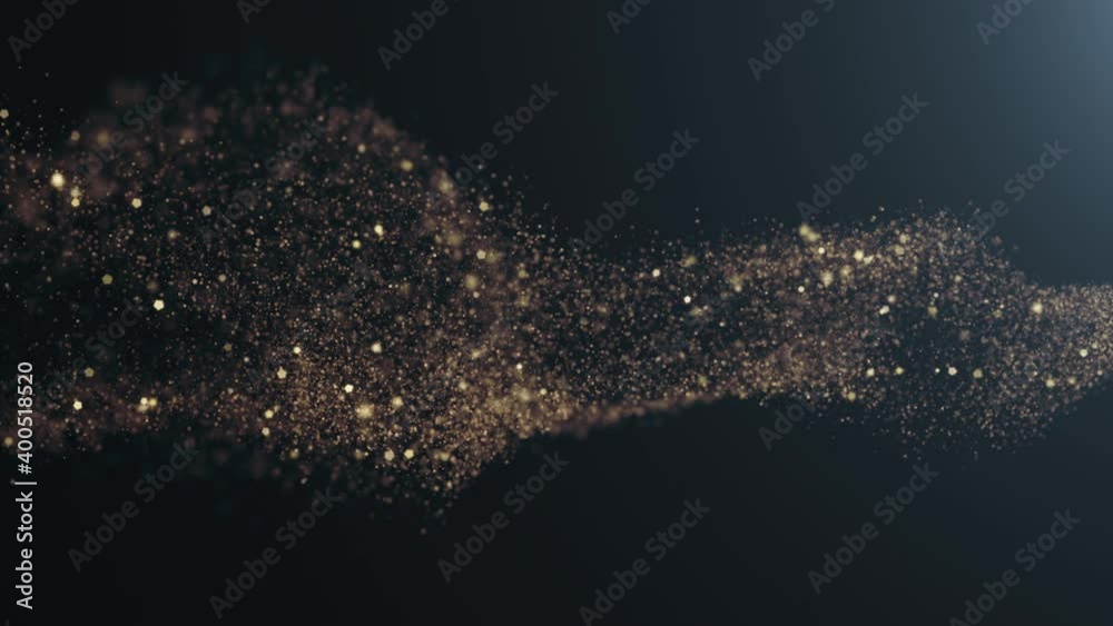 Gold glitter and particles in motion. Christmas gold glitters. Bokeh. 3D glowing dust trail. Isolated on black.