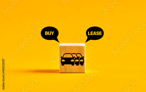 Car vehicle fleet icon on wooden cube with buy or lease choice. Buying or leasing dilemma.