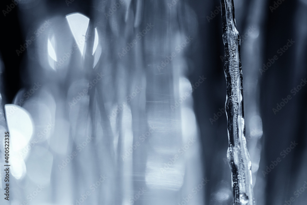 close up illuminated winter icicle at night close up illuminated winter icicle at night