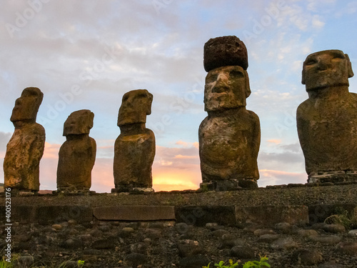Statues of Easter Island in the background of the sunset. melting of the Easter statue in the sunlight of the sunset. photo