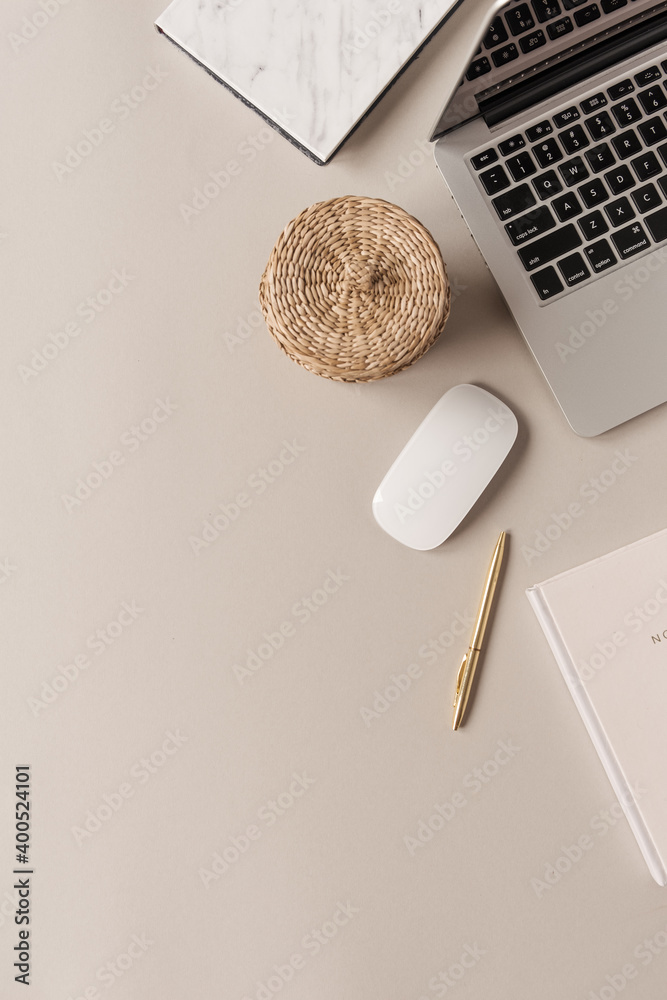 Home office desk workspace with laptop, straw casket on neutral background. Flat lay, top view blog, website, social media concept. - obrazy, fototapety, plakaty 