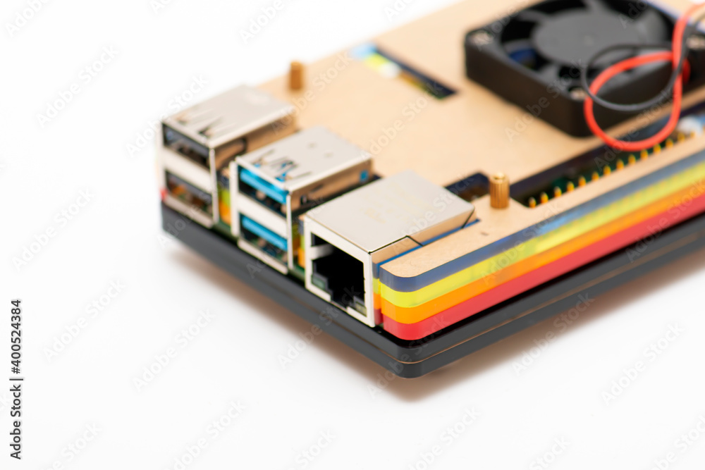 Focused USB 3.0 and RJ-45 connectors, defocused remainder of the microboard computer in multi-colored case Focused USB 3.0 and RJ-45 connectors, defocused remainder of the microboard computer in multi-colored case