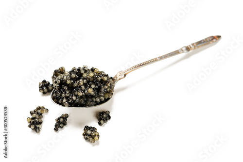 Black Caviar in a spoon isolated on white background.