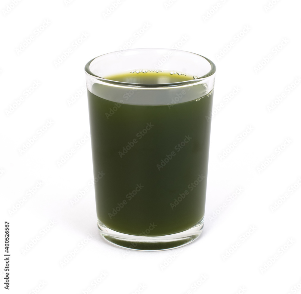 Green vegetable smoothie juice in glass isolated on white background. Clipping path. Green vegetable smoothie juice in glass isolated on white background. Clipping path.