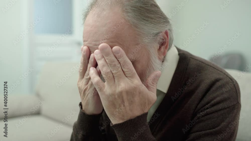 Depressed old man covering face with hands, incurable disease, negative thoughts Depressed old man covering face with hands, incurable disease, negative thoughts
