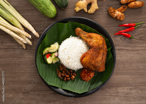 Nasi Kukus is usually comprising freshly steamed rice and crispy fried chicken photo