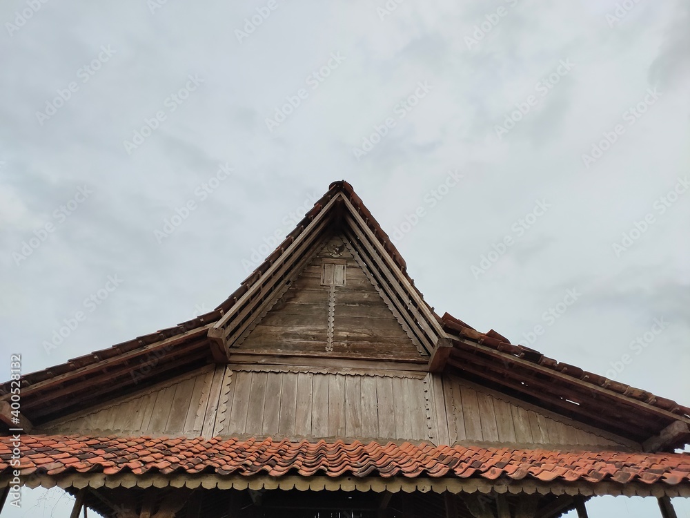 Wooden attic in Southeast Asia. Against a clear sky backdrop