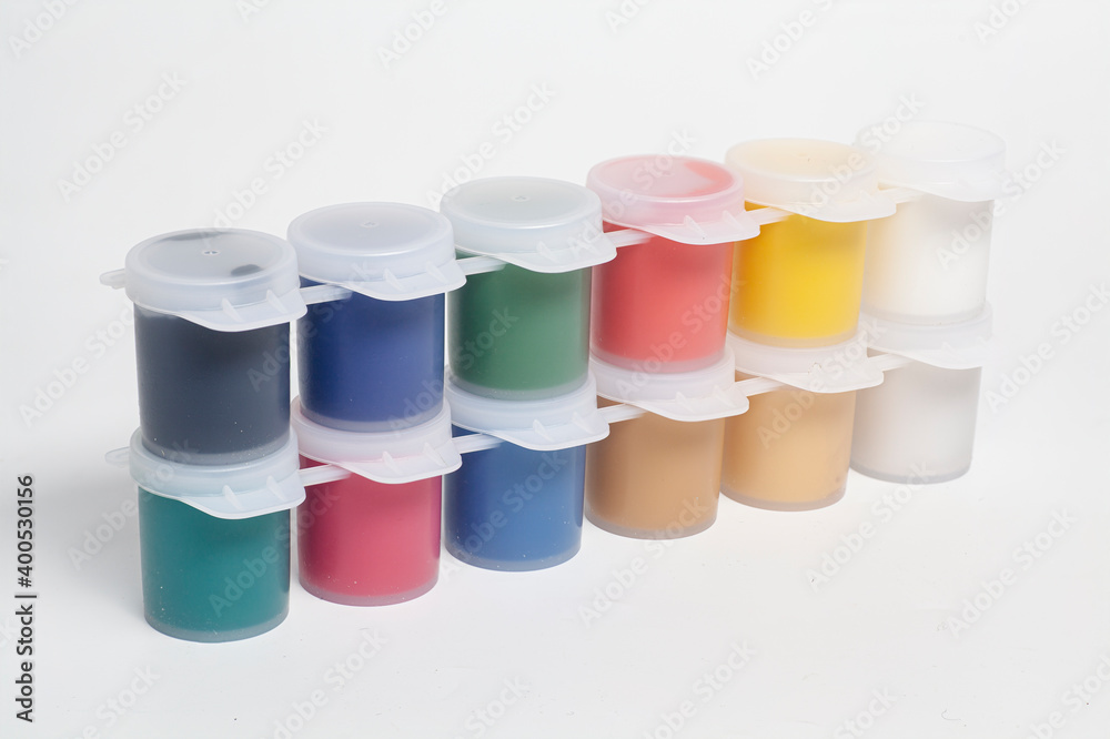 Plastic jars with multicolored gouache paints Plastic jars with multicolored gouache paints