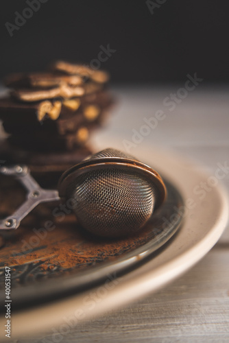 strainer cocoa whit chocolate on wood background  © Maksym