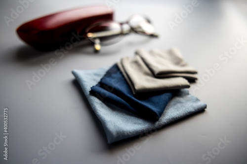 Eyeglass Cleaning Cloths with eyeglass case on gray background 