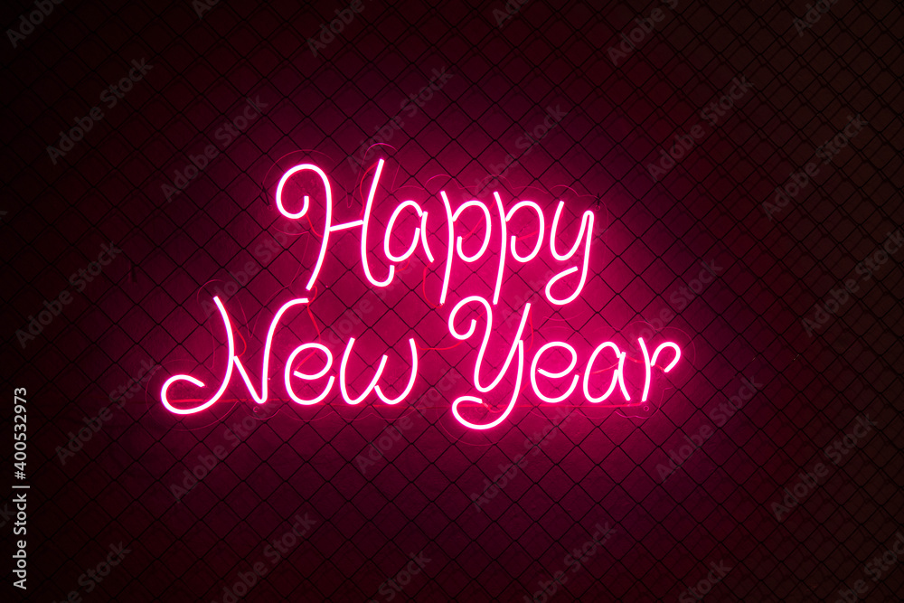 Abstract red colored lifht bright neon text Happy New Year