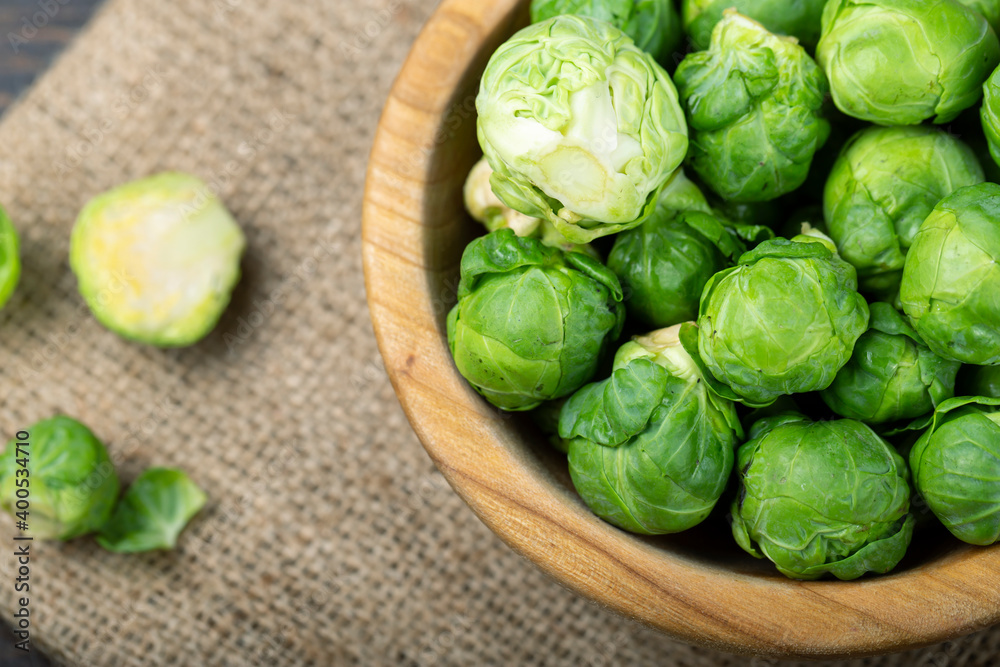 Brussels sprouts in a wooden bowl. Harvesting. Brussels sprouts in a wooden bowl. Harvesting.