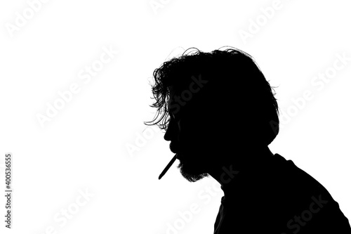 Monochrome silhouette of a smoking man isolated on white background.