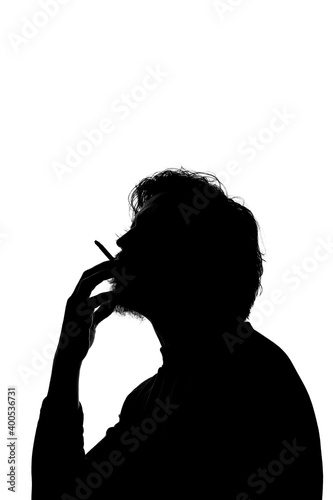 Monochrome silhouette of a smoking man isolated on white background.