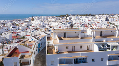 Aerial views of white town in the province of Cadiz, Andalusia. Conil de la frontera seen from above, in south Spain
