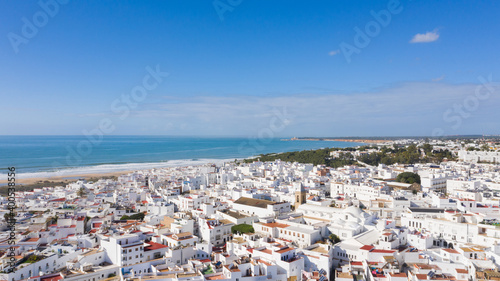 Aerial views of white town in the province of Cadiz, Andalusia. Conil de la frontera seen from above, in south Spain