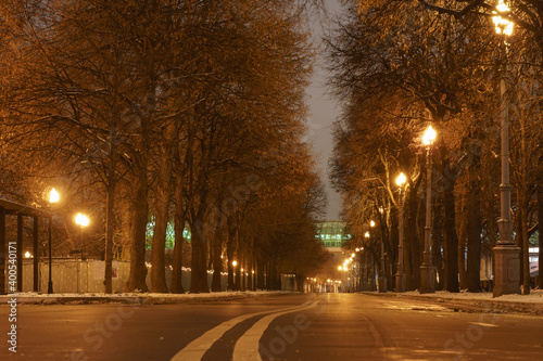 Photography of empty alley in the Gorky park during coronavirus pandemic. Andreevsky (Pushkinsky) pedestrian bridge in the distance.
