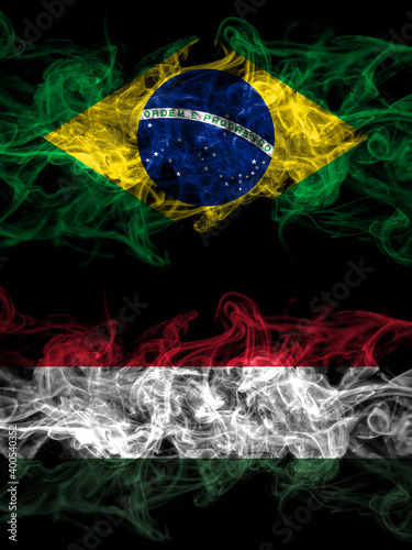 Brazil  Brazilian vs Hungary  Hungarian smoky mystic flags placed side by side. Thick colored silky abstract smoke flags.