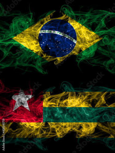 Brazil  Brazilian vs Togo smoky mystic flags placed side by side. Thick colored silky abstract smoke flags.