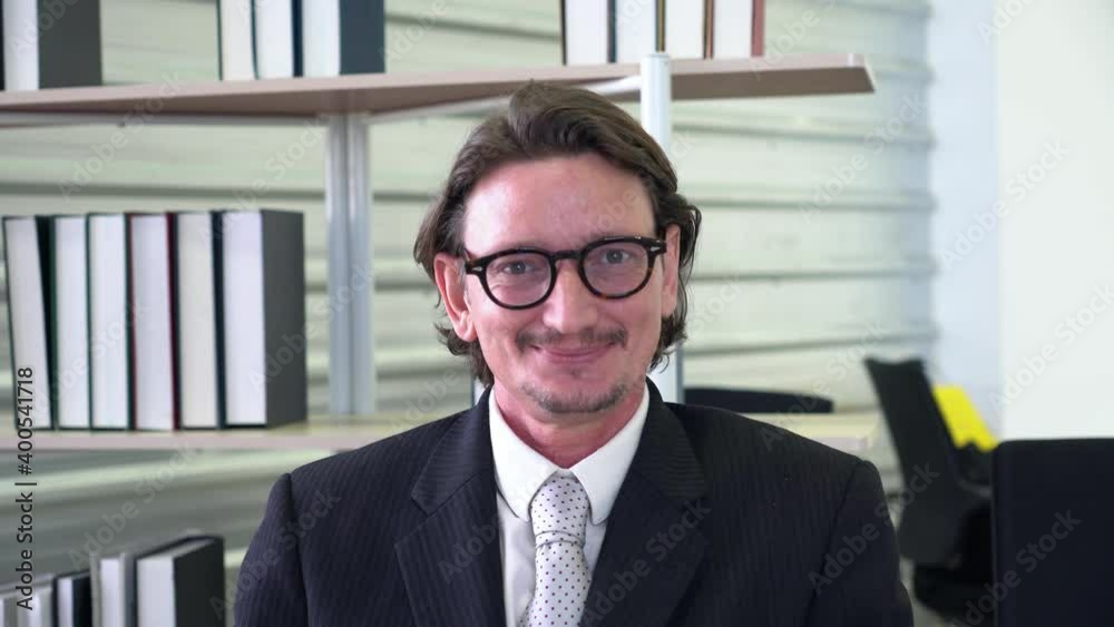 portrait of middle age caucasian man with smiling face in office portrait of middle age caucasian man with smiling face in office