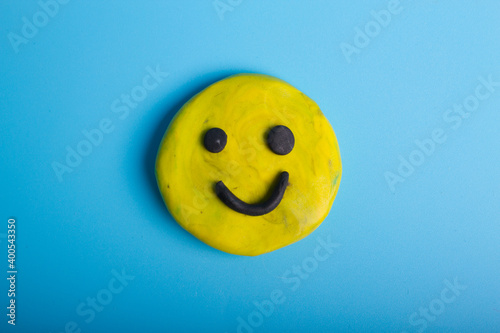 Yellow smiley on blue background
