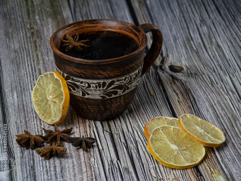 Clay cup of Tea. Cinnamon, star anise and dried lemon