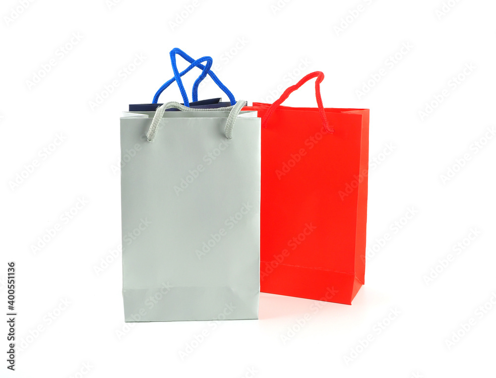 Paper shopping bags (grey, red, blue) isolated on white background, with space for your text.. Paper shopping bags (grey, red, blue) isolated on white background, with space for your text..