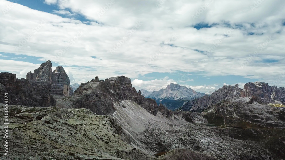 A panoramic view on Italian Dolomites. There are many high and sharp peak in front, with many landslides. Dangerous climbing. Barely any plants growing in the area. Raw and unspoiled landscape. A panoramic view on Italian Dolomites. There are many high and sharp peak in front, with many landslides. Dangerous climbing. Barely any plants growing in the area. Raw and unspoiled landscape.