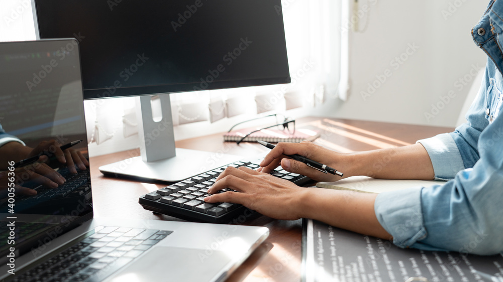 Fototapeta premium Software developer or programmer working data debugging improvement binary algorithm on desktop pc in a software develop company office.