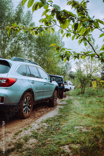 three suv cars at mud off road trail in forest © phpetrunina14