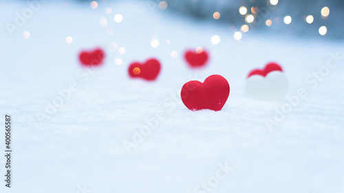 heart on snow, concept valentine's day holiday background, bokeh from light garlands new year