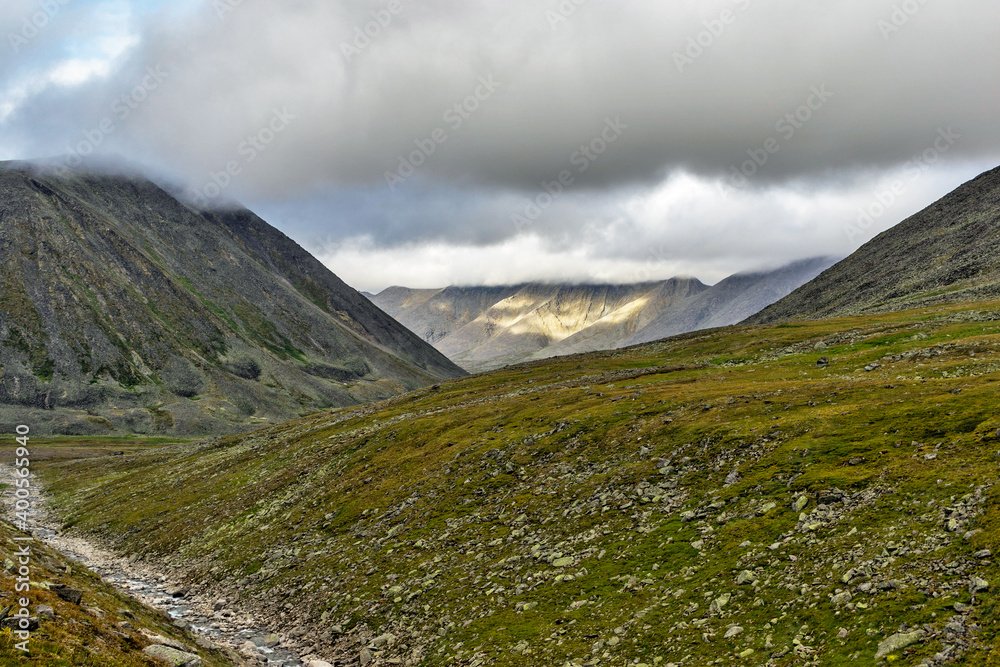 mountain range in the clouds on a cloudy day