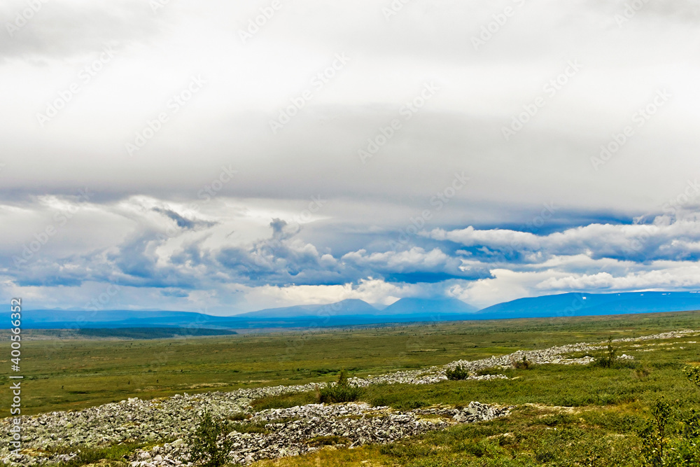 northern tundra and the mountain range on a summer day northern tundra and the mountain range on a summer day