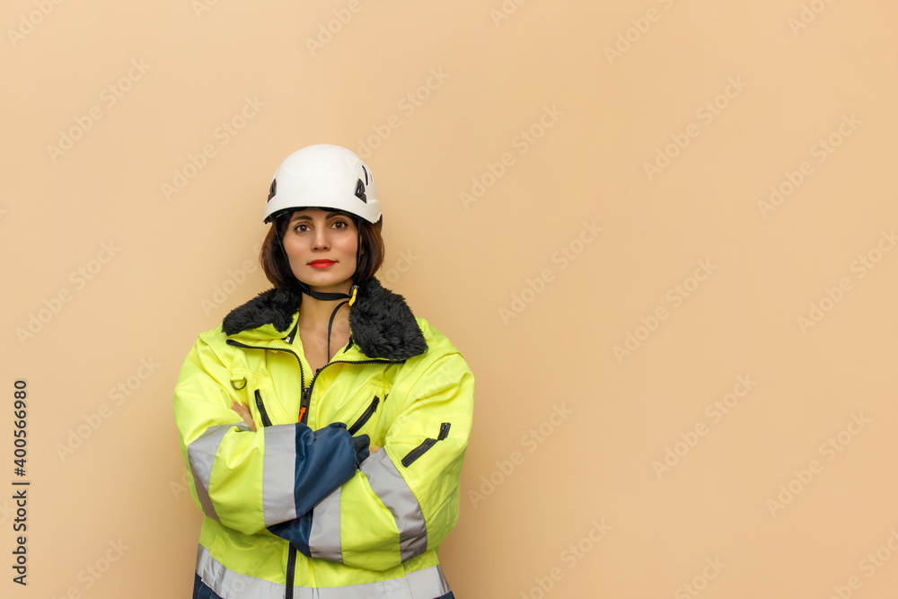 Female industrial worker in hard hat. Woman engineer with white hard hat helmet. Climber Female industrial worker in hard hat. Woman engineer with white hard hat helmet. Climber