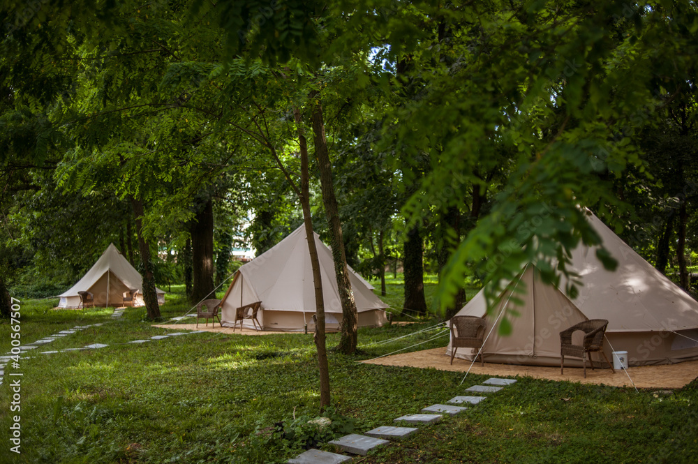 Glamping site in the woods on a calm afternoon.