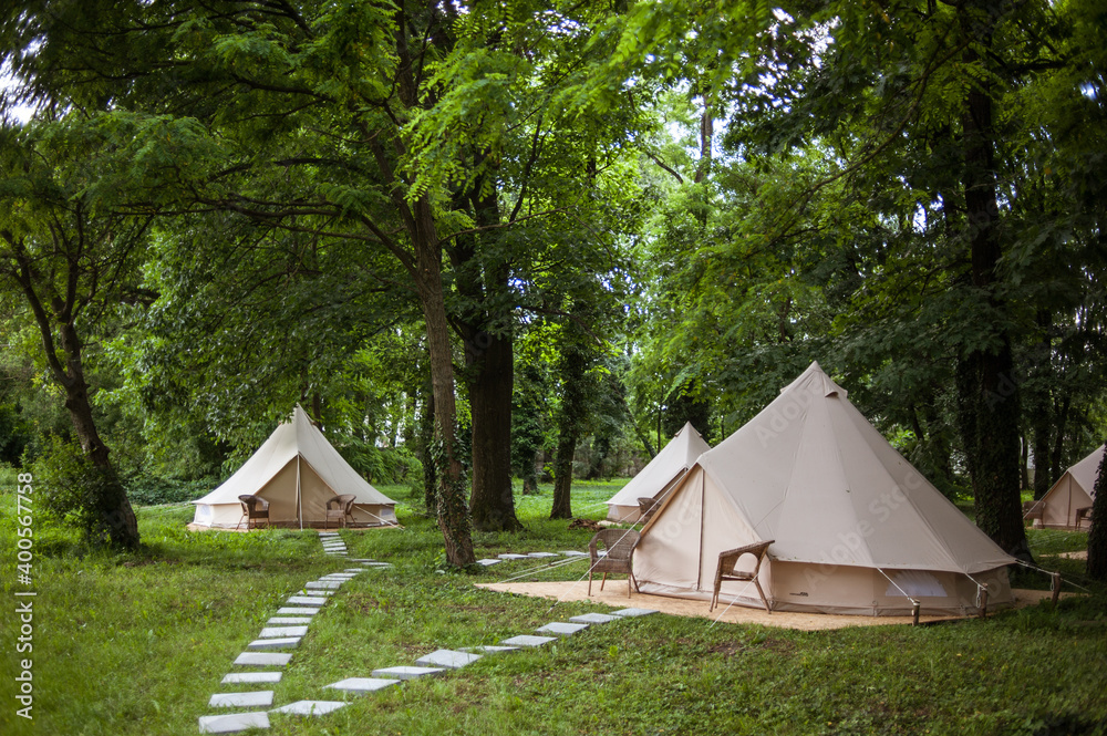 Glamping site in the woods on a calm afternoon.