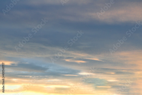 The sky at sunset. Cumulus clouds lit by the rays of the setting sun. © Anatoliy