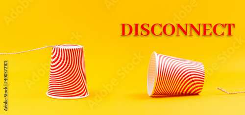 Bilde på lerret Two cardboard red cups with strings lying apart