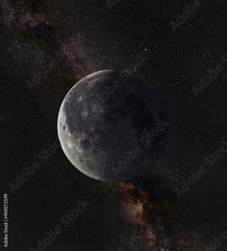 Moon, view from space. With craters and a shadow from the sun, against the background of the Milky Way. © Aleksey