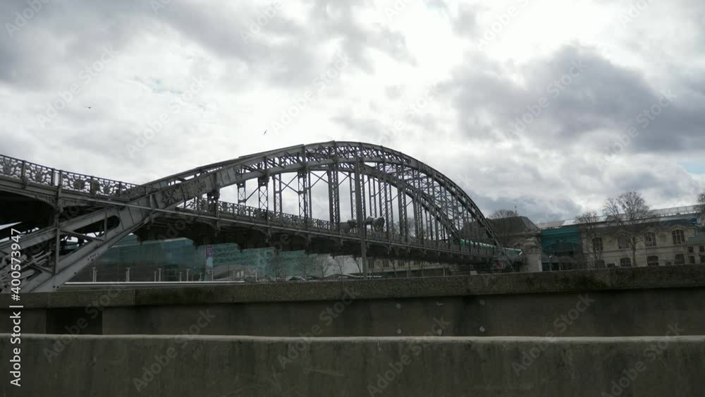 Paris France. Quay and Railway Metro Bridge Seine River. Ile-de-Cite. Old European Architecture. POV Tourist in car. Slow motion Paris France. Quay and Railway Metro Bridge Seine River. Ile-de-Cite. Old European Architecture. POV Tourist in car. Slow motion