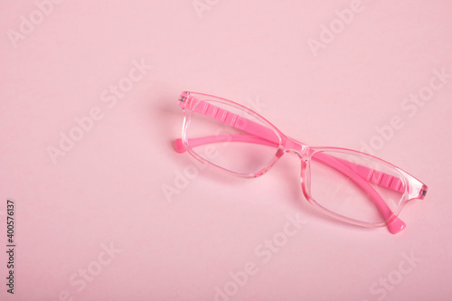 children's glasses for a girl on a pink background, horn-rimmed glasses