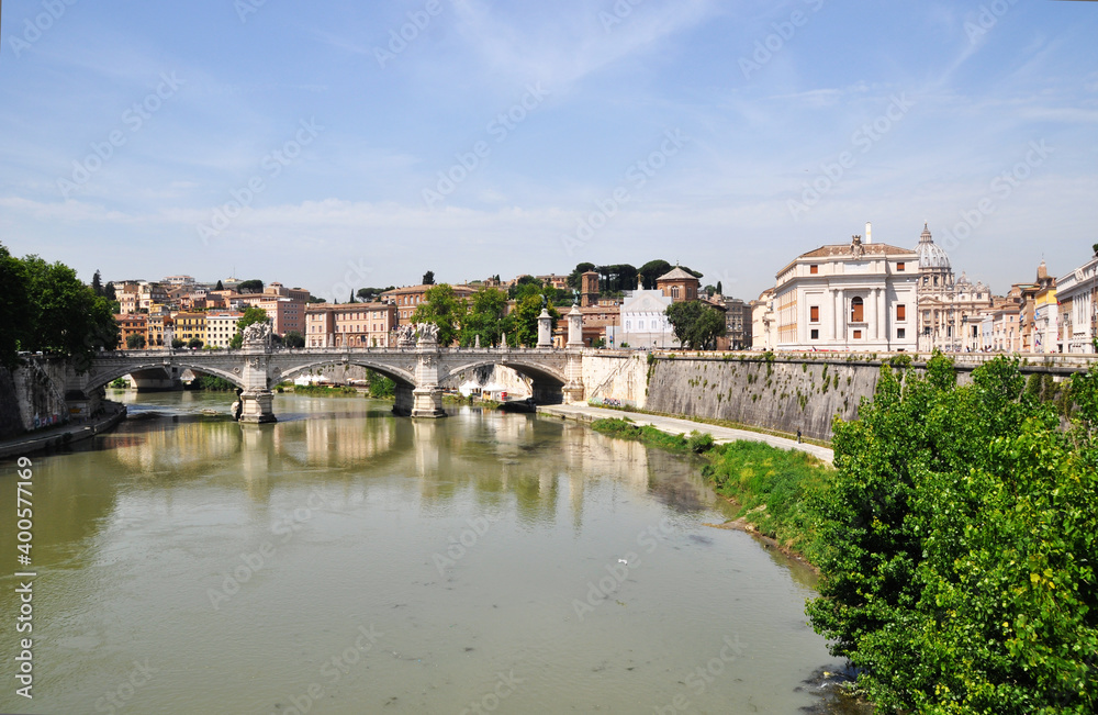 Panoramic views of the river and the stone arch bridge. Stone houses along the river