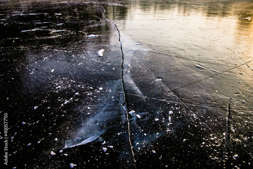 the frozen surface of the lake formed a smooth surface with beautiful cracks